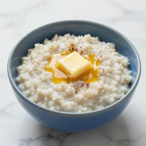 A bowl of traditional Norwegian Rommegrot topped with cinnamon and sugar.